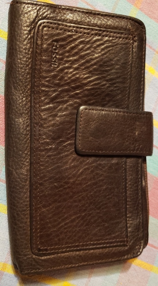 Slightly used Fossil wallet with genuine leather.